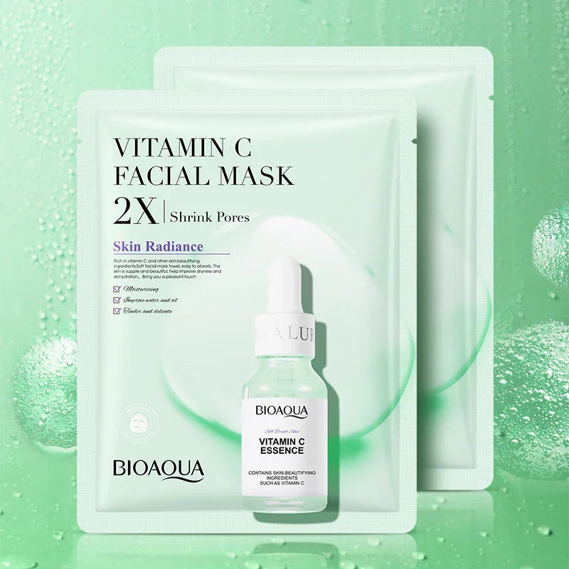 Bioaqua vitamin C facial mask and essence bottle on green background, skincare product at SouqFinds- Collagen Face Mask Moisturizing Firming Face Sheet Mask Hyaluronic Acid Facial Masks Beauty Skin Care Gel Skin Care